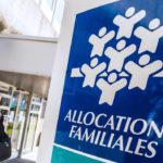 A woman walks past a branch of the Caisse d'Allocations Familiales (Family Allocations Office, or CAF) in Calais on April 15, 2015. AFP PHOTO PHILIPPE HUGUEN / AFP PHOTO / PHILIPPE HUGUEN